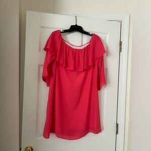 Woman’s coral off the shoulder dress.